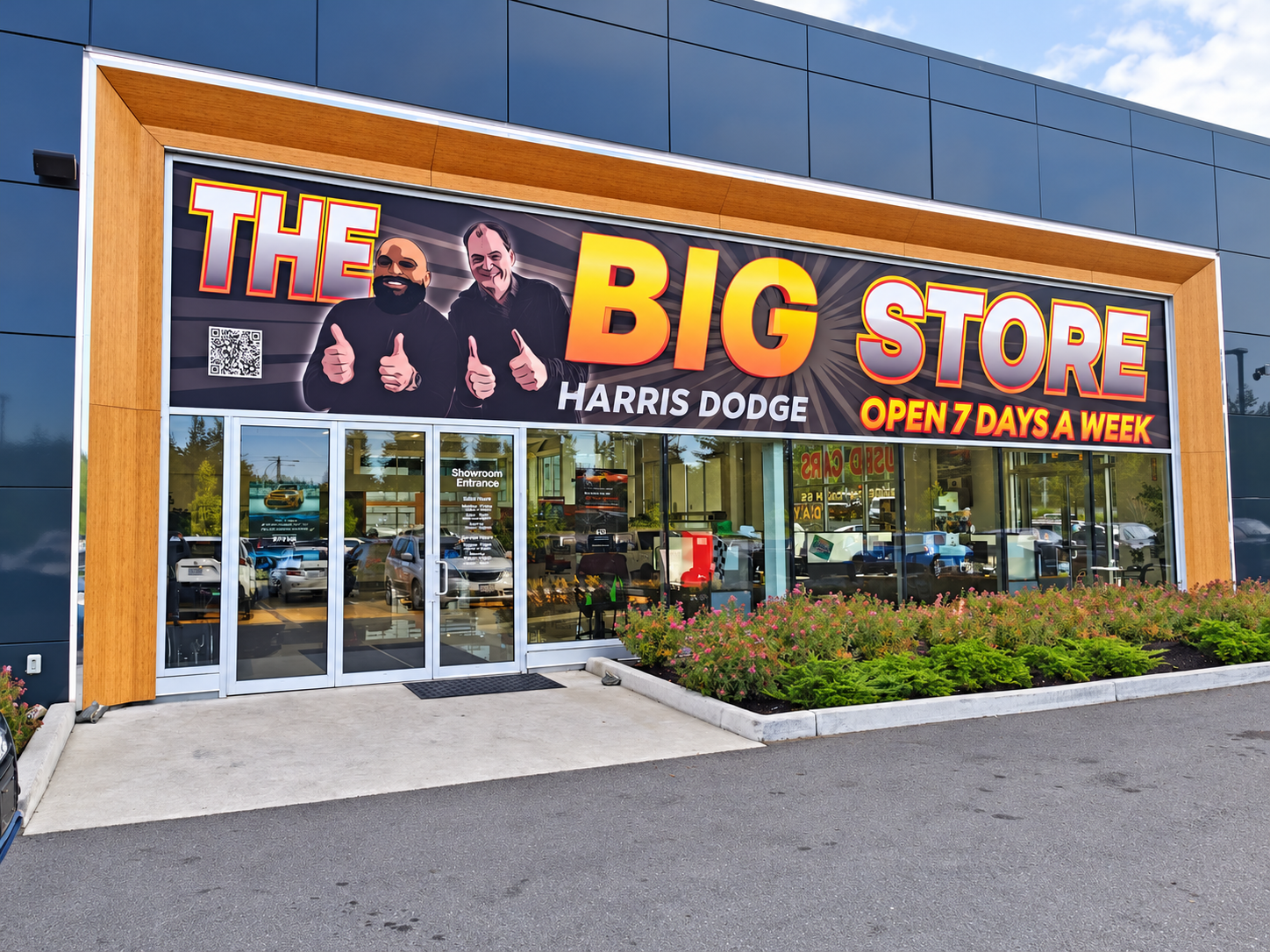 Large-format Harris Dodge storefront graphics above the showroom entrance
